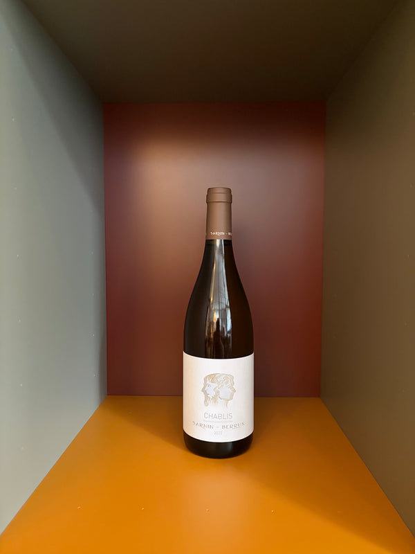 Chablis 2022 wine bottle by Sarnin-Berrux, clear glass with cream label and brown cap