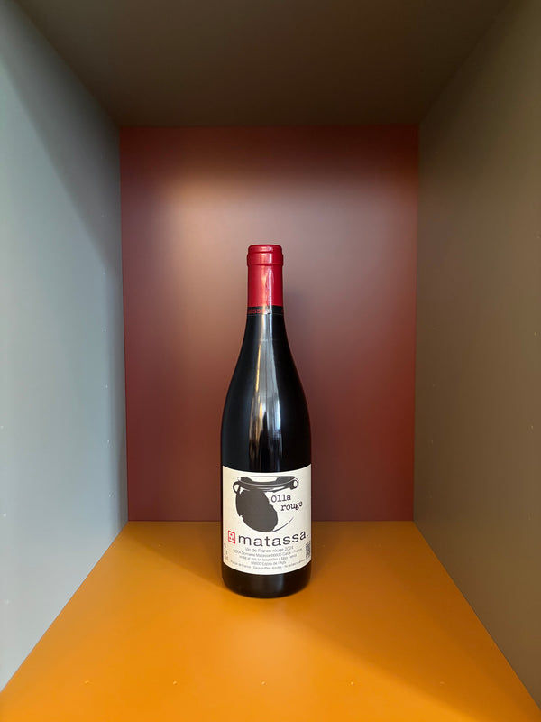 Red wine bottle with red cap and front label