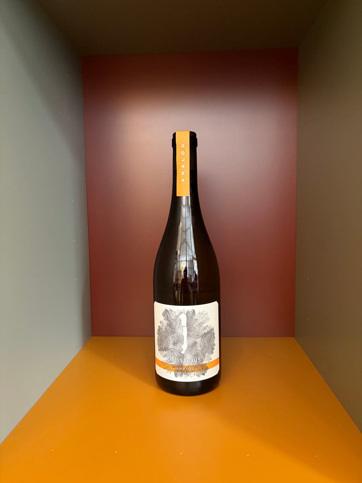 Kristinus analog wine bottle, dark glass with yellow foil cap and cream label