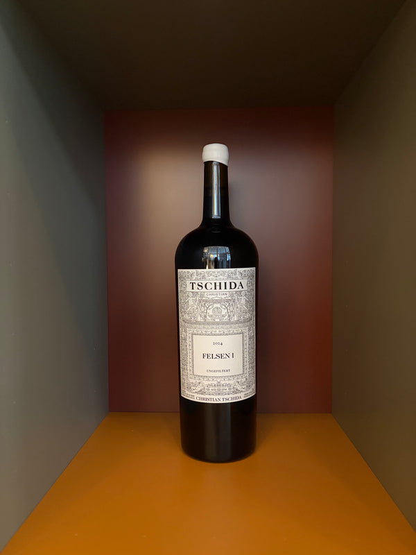 Christian Tschida Magnum wine bottle, dark glass with white label and seal